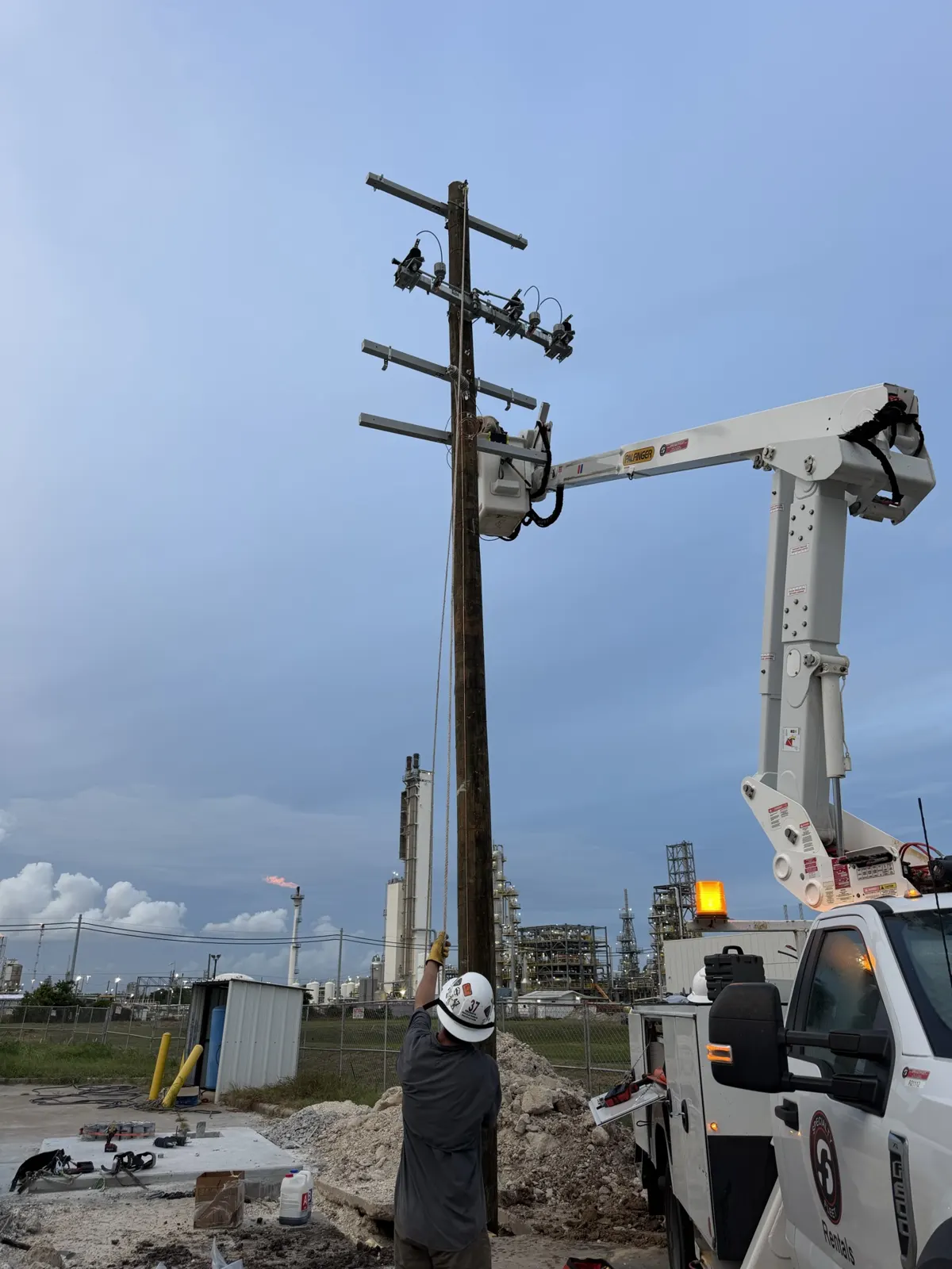 Bucket truck working at crossarm height on a utility pole in La Porte, TX