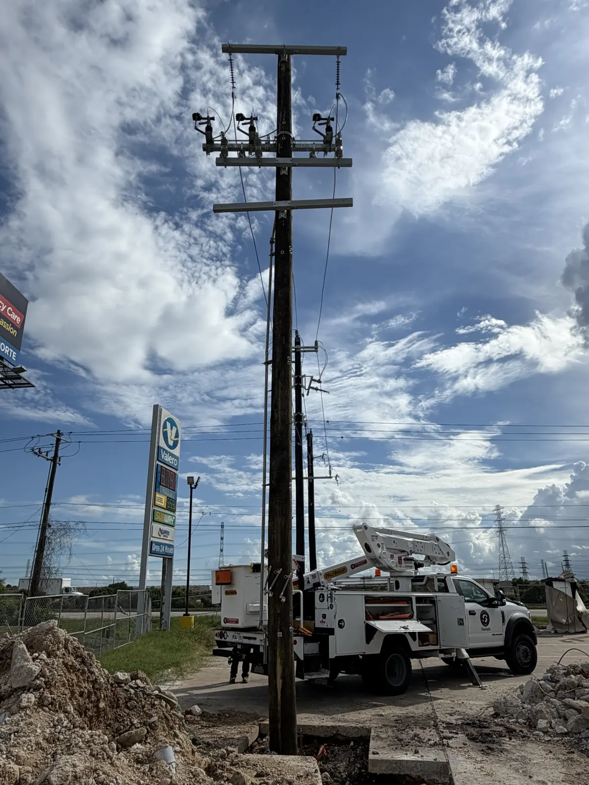 Framed utility pole with crossarm at a Tesla charging station project in La Porte, TX