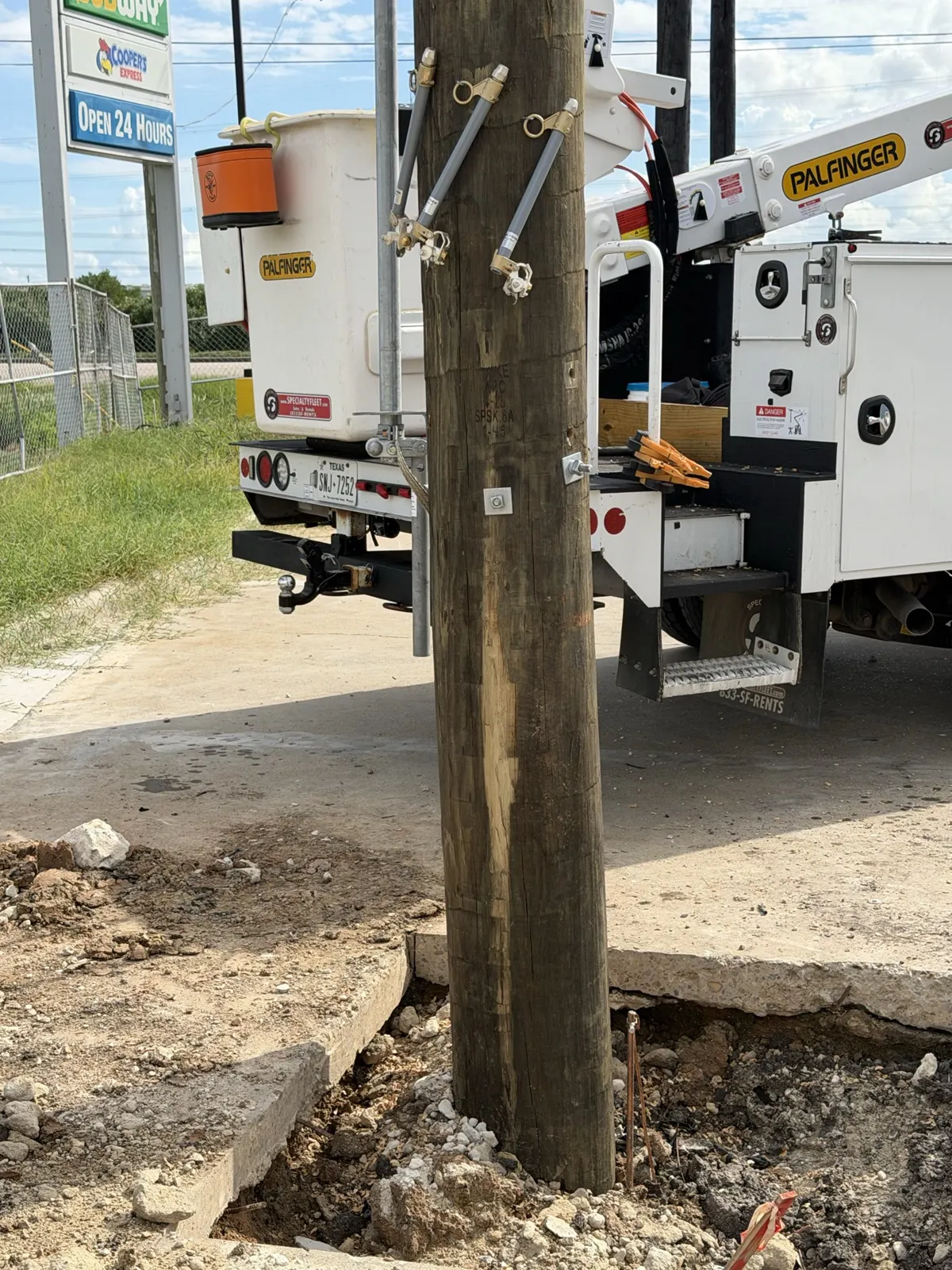 Bucket truck parked beside a new utility pole in La Porte, TX