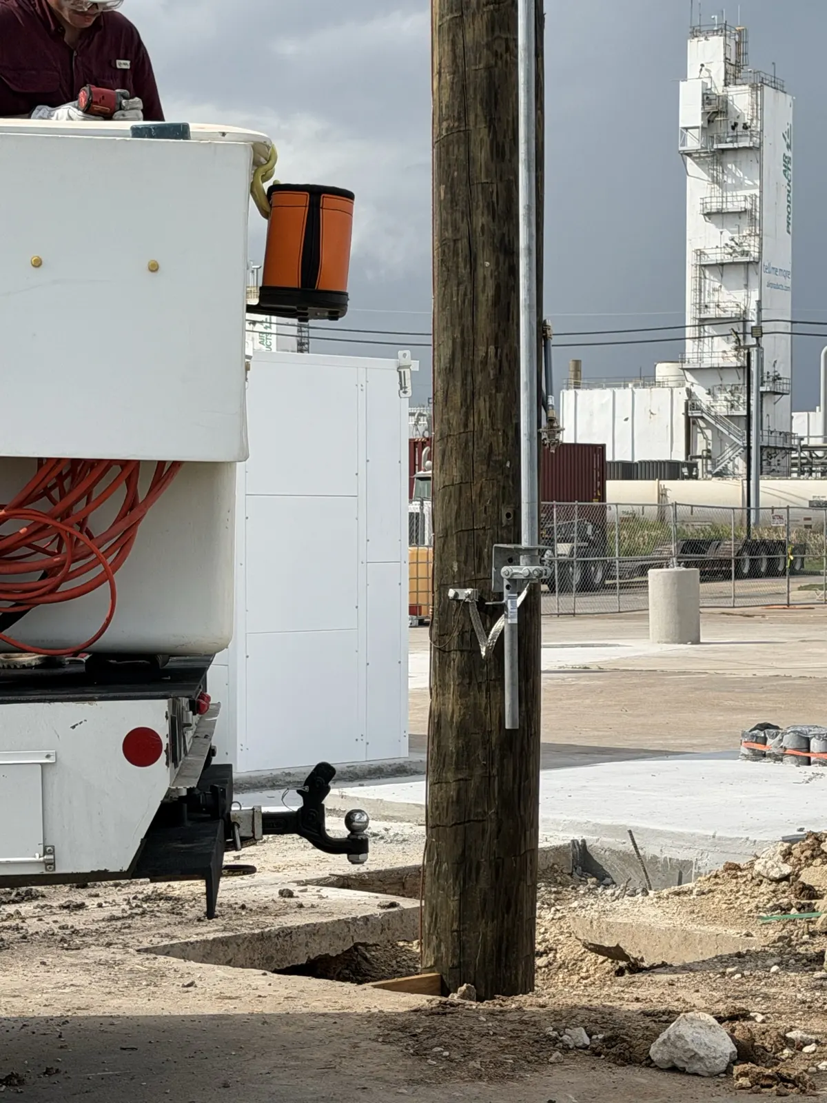 Utility pole set next to a work truck at a La Porte, TX job site