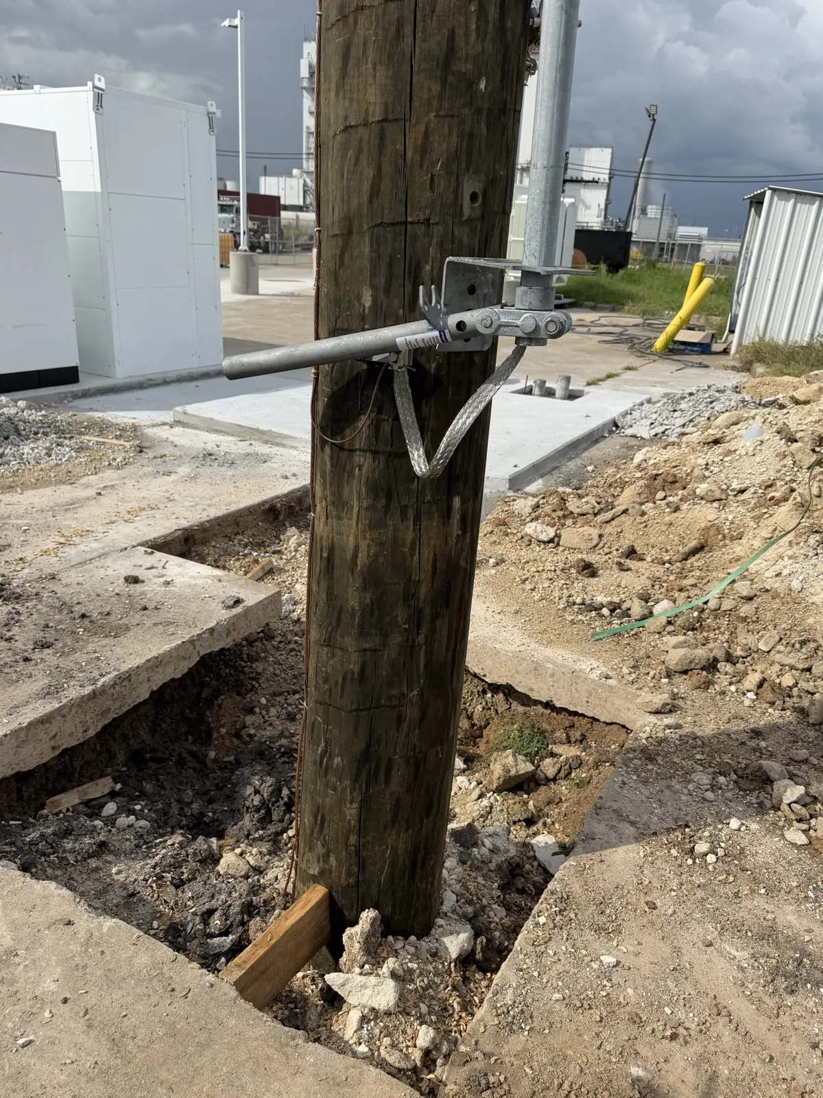Utility pole base at the edge of an excavation in La Porte, TX