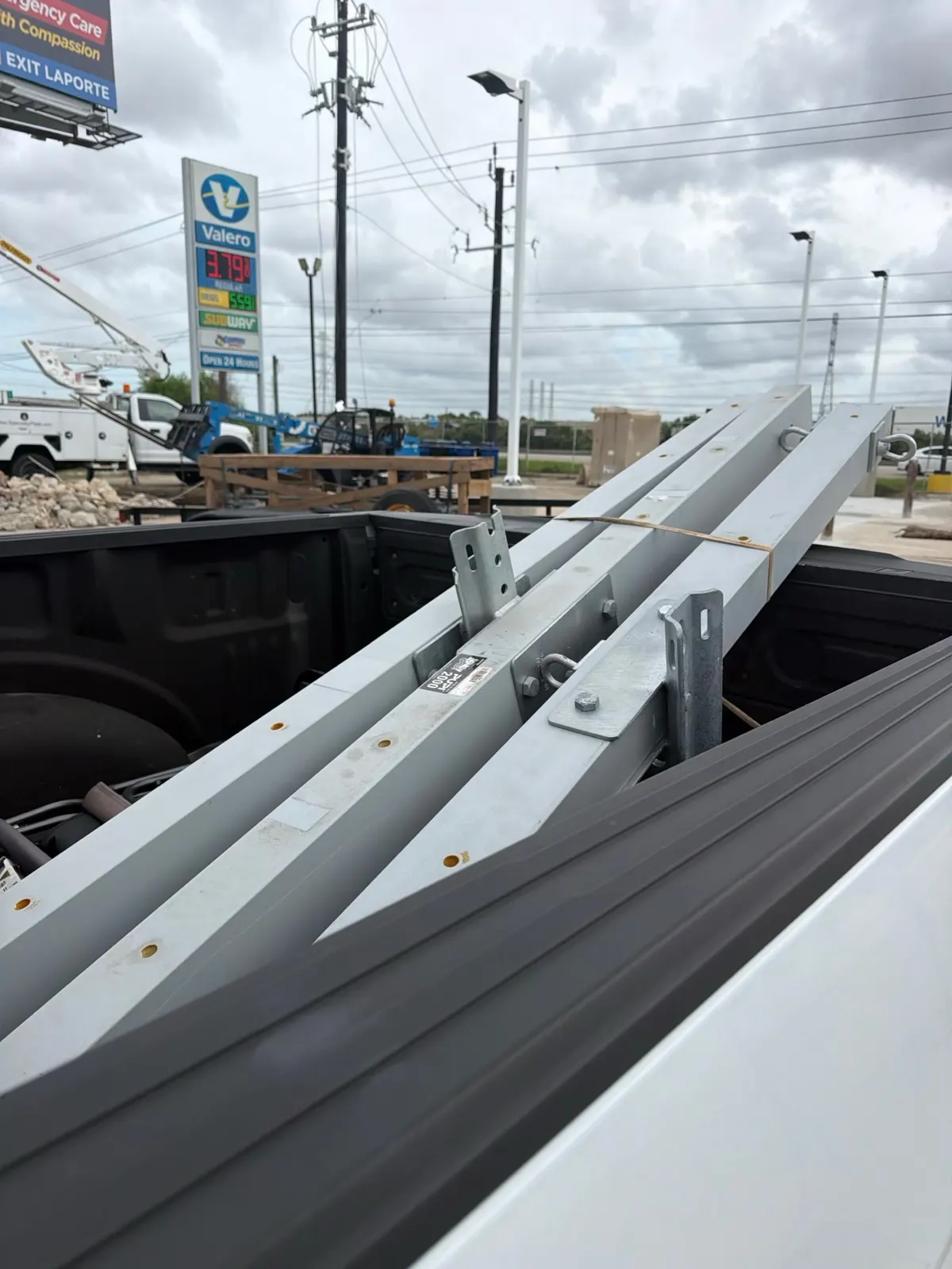 Bucket truck boom and equipment at a La Porte, TX Tesla charging station job site